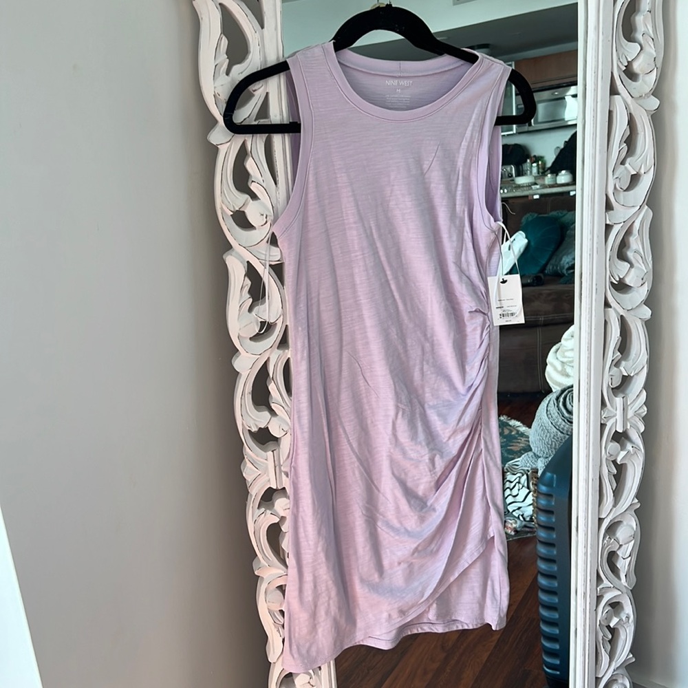 Mine west brand new bodycon dress with criss cross bottom